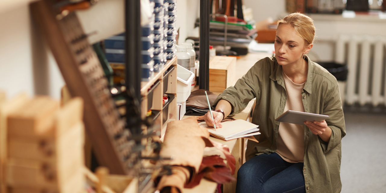 Woman making notes on a stock inventory.