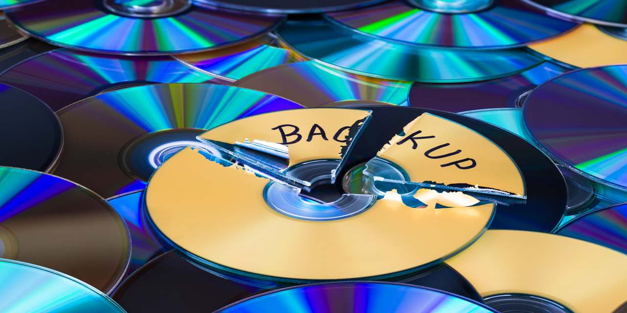 CD / DVD  Media with broken disc reading 'Back Up'.