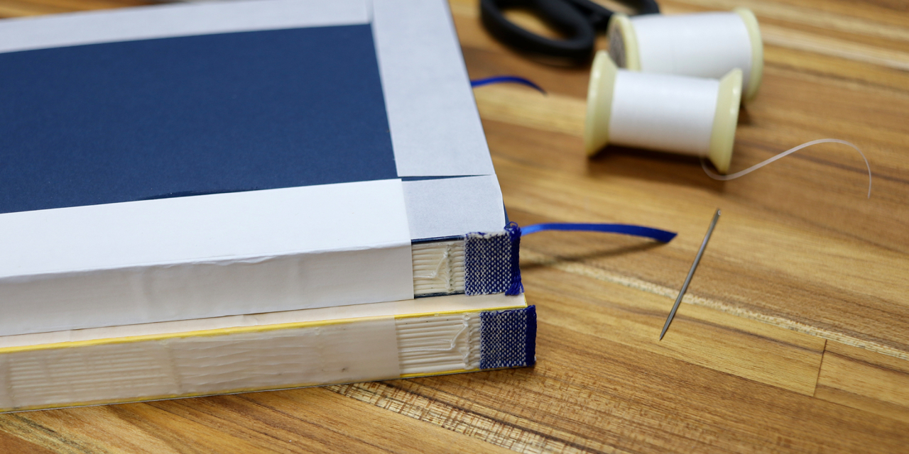 Books without spines ready for assembly.
