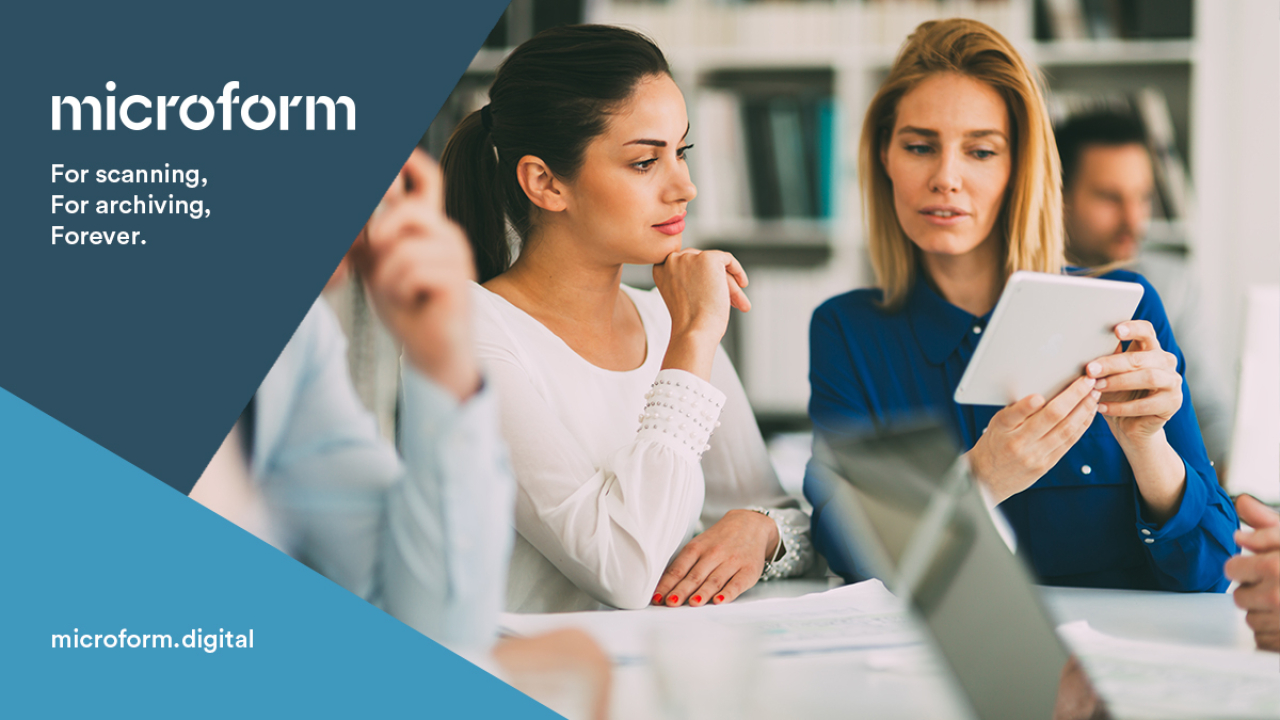 Microform Branding - Colleagues looking at a digital screen.