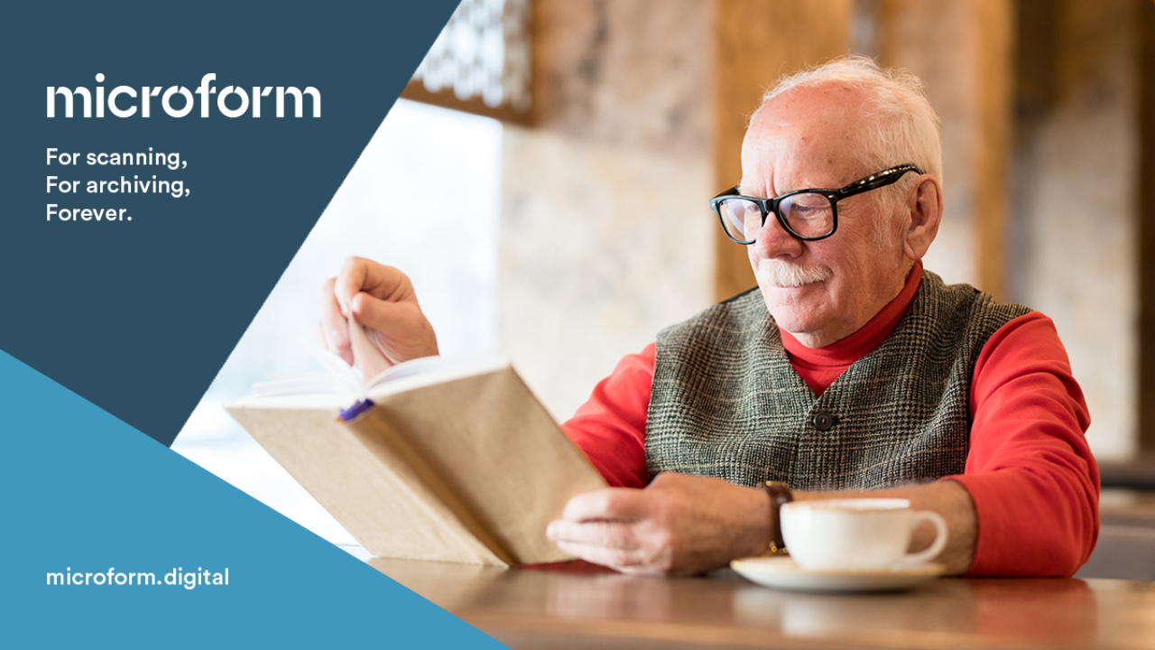 Microform Branding - Old man reading a book at a desk.